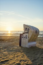 White beach chair and mudflats