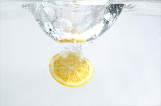 Lemon in the Water on White Background