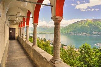 Panoramic View over a Lake Maggiore and Snow-capped Mountain and Arches from Church Madonna del Sasso in Locarno