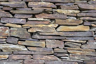 Slate slabs stacked to form a wall