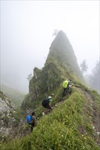 Mountaineers in the fog climbing Marwes