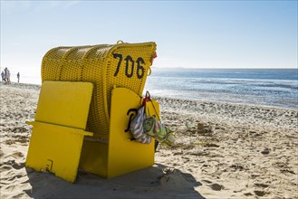 Yellow beach chair and mudflats