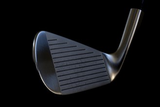 Golf Club Iron on Black Background