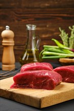 Closeup view of raw beef steak on cutting board