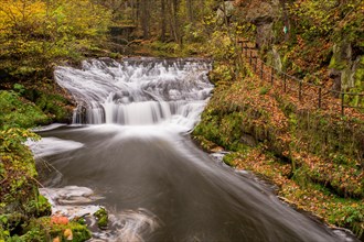 Waterfall in autumn in a gorge