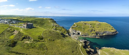 Aerial panorama of the rugged coastline on the Celtic Sea with the Tintagel Peninsula and the ruins of Tintagel Castle