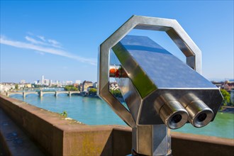 Telescope over Rhine River and City of Basel in a Sunny Day in Switzerland