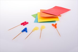 Colored envelopes and Color candles on sticks write happy