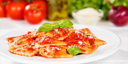 Ravioli Italian pasta in tomato sauce eat lunch dish with plate Panorama in Stuttgart