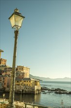 Boccadasse and a Street Lamp in a Sunny Day and Mediterranean Sea in Genoa