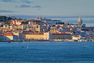 View of Lisbon over Tagus river from Almada with yachts tourist boats on sunset. Lisbon