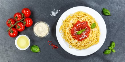 Spaghetti eat Italian pasta lunch dish with tomato sauce from above on slate panorama in Stuttgart