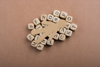 Paper man and letter cubes of made of wood