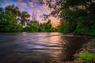 Long exposure on the bank of the river Saale in summer at sunset