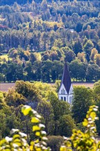 Church steeple of a country church in a beautiful landscape in autumn