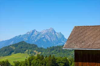 Rooftop and Mountain Peak Pilatus with Clear Blue Sky in Burgenstock