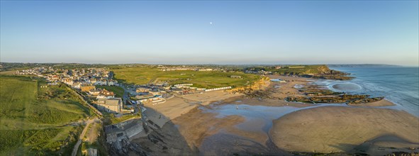Aerial panorama of the coastline of Bude Bay at low tide with bathing beaches Crooklets Beach