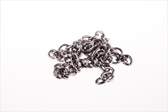 Metal chain on white background