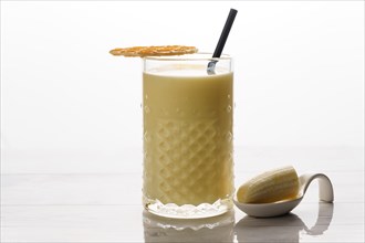 Close up of a banana milkshake with natural bananas
