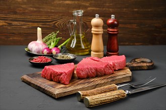Three large raw tri-tip loin beef steaks