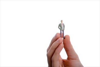 Figurine model men in hand on a white background