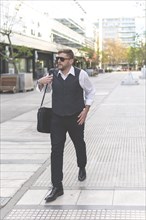 Businessman walking down the street