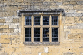 Window surrounded by Cotswoldstone yellow limestone block