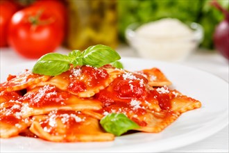 Ravioli Italian pasta in tomato sauce eat lunch dish with plate in Stuttgart