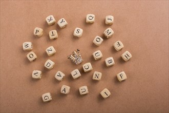 Letter cubes of Alphabet made of wood around crown