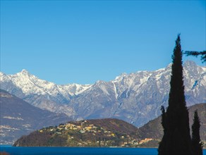 Village on Lake Como with Snow-capped Mountain in Lombardy