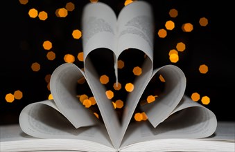 Three Hearts form a Book with Light Effect