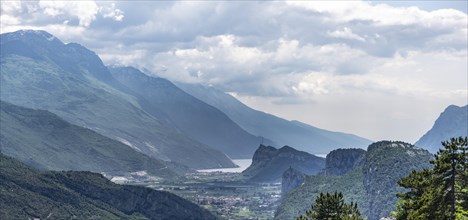 View into the Sarca Valley towards Lake Garda with rocks of Castello di Arco