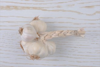Cloves of garlic placed on a wooden texture