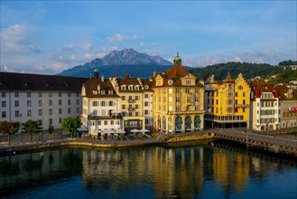 City of Lucerne with River and Building and Mountain Pilatus in a Sunny Day in Switzerland