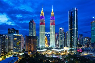 Petronas Twin Towers skyscrapers KLCC skyline in the evening of Kuala Lumpur