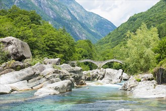 River in Valley Verzasca and Bridge Ponte dei Salti with Mountain in a Sunny Day in Ticino