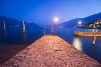 Pier on Lake Maggiore with Mountain in Dusk in Ascona