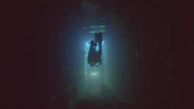 Scuba diver swim inside of ferry Salem Express shipwreck