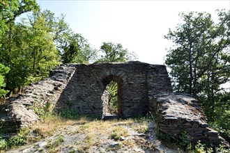 The 14th-century Hellkirch ruin built of slate on a rocky spur above the Hahnenbach valley near Woppenroth in Hunsrueck