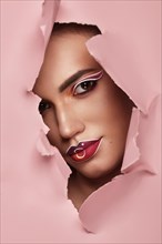 Beautiful woman with creative makeup and purple lips. Beauty face. Art makeup