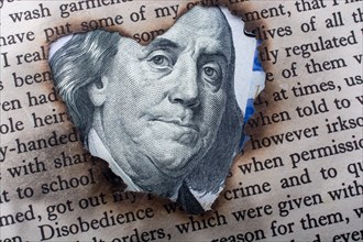 Close up of Benjamin Franklin face on 100 US dollar bill