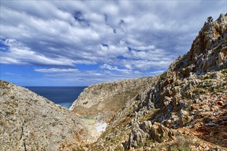 Rocky sandstone cliffs of typical Greek or Cretan sea shores