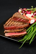 Grilled tri-tip loin beef steaks medium rare