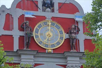 Gable of the town hall with clock and figures