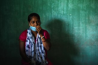 A woman waiting to receive COVID-19 coronavirus vaccine dose during a vaccination campaign on the outskirt of Guwahati in India on Monday