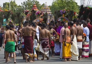 Hindus in traditional dress on the main festival day at the big parade Theer