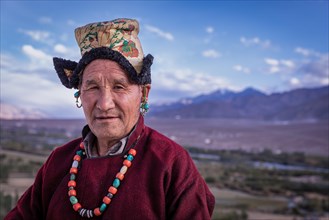 Elderly man in traditional Ladakhi clothes