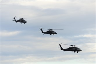 American military helicopters flying in formation