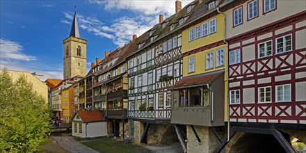 Half-timbered houses of the Kraemerbruecke with the river Gera and the Aegidienkirche