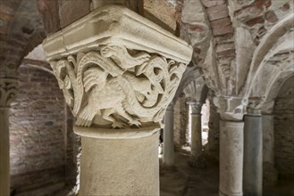 Romanesque capital with vine and bird